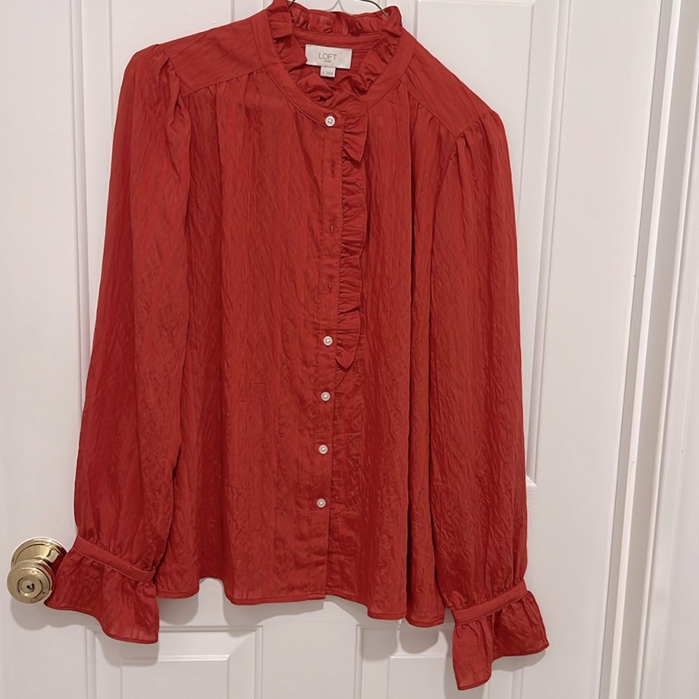 NWOT Loft Outlet size Small blouse in rust orange color. Ruffle details.